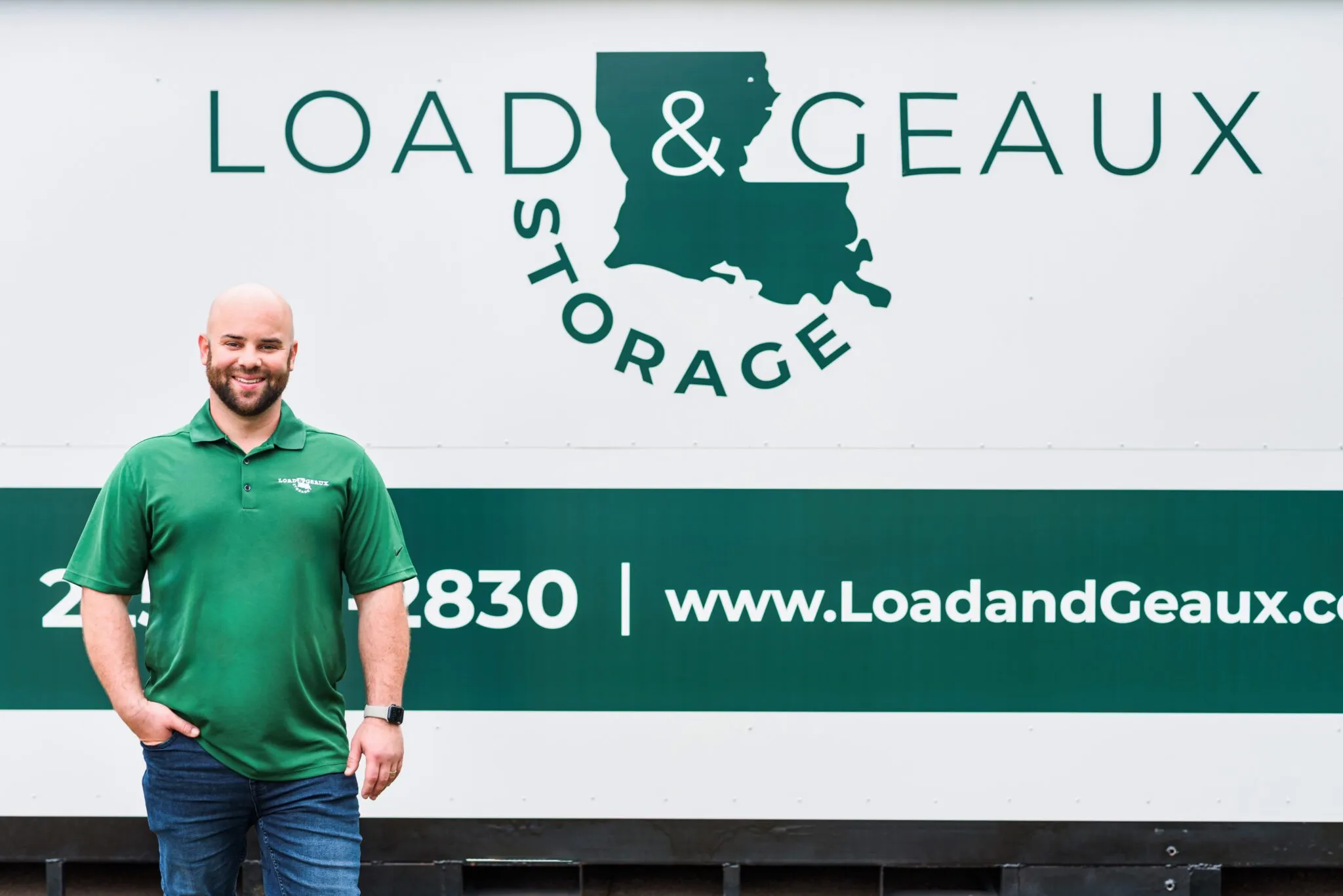 zackery fields in front of lead and geaux truck