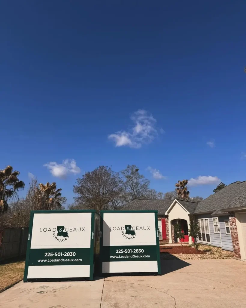 two load and geaux portable storage units in driveway of house